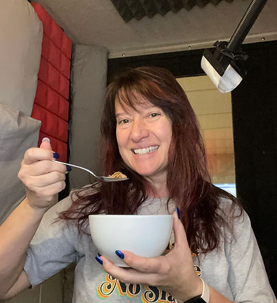 Jen Tophoney with a bowl of cereal in her booth - to record ceral noises